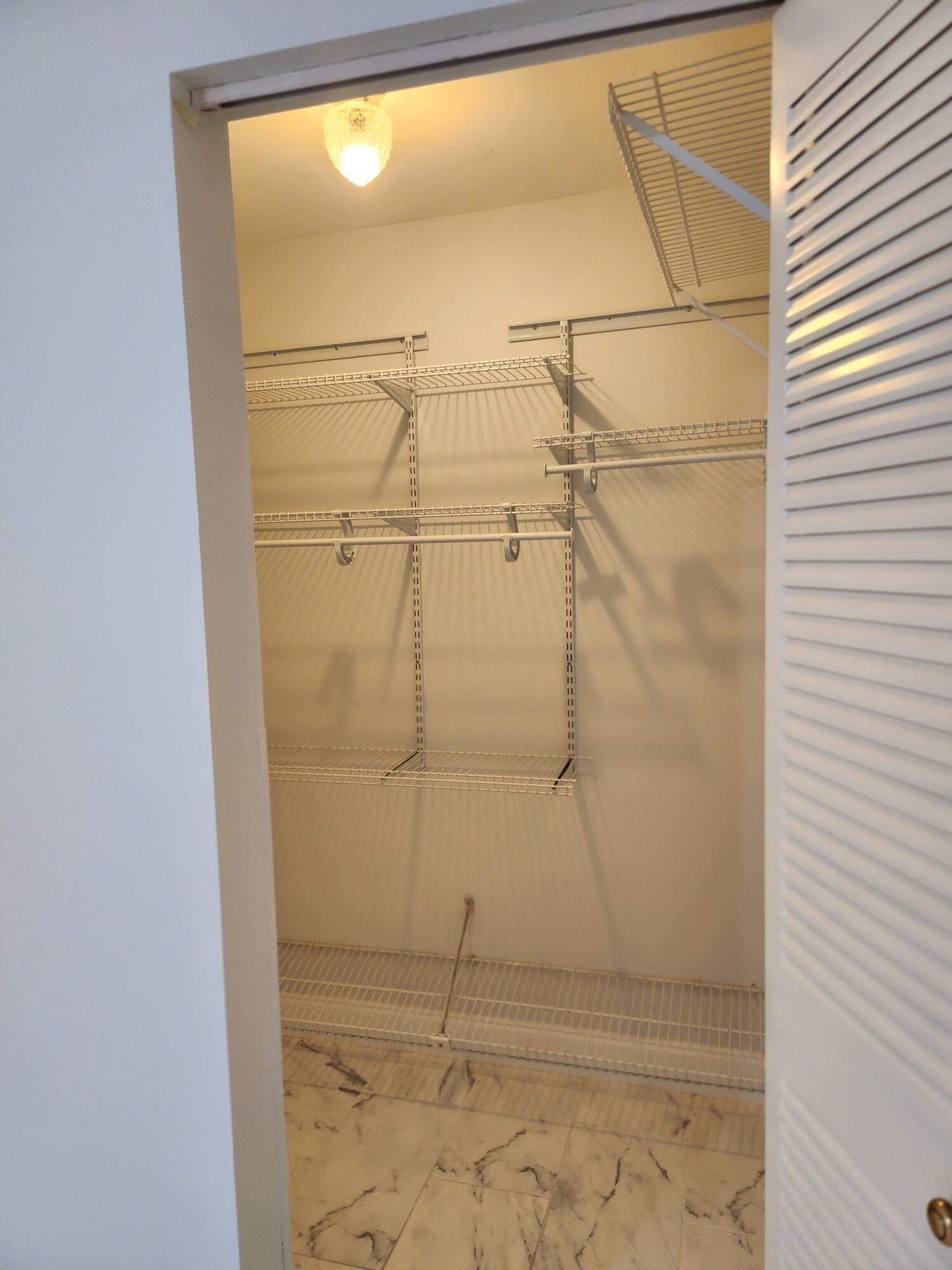 5433 Lakefront Boulevard, Unit B Delray Beach, FL 33484 - Photo 13 of 13 a bathroom with a shower