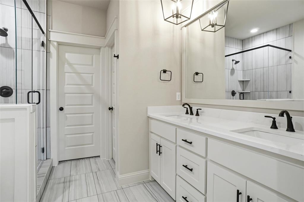 201 Legacy Boulevard Weatherford, TX 76085 - Photo 12 of 25 a spacious bathroom with a shower sink and mirror