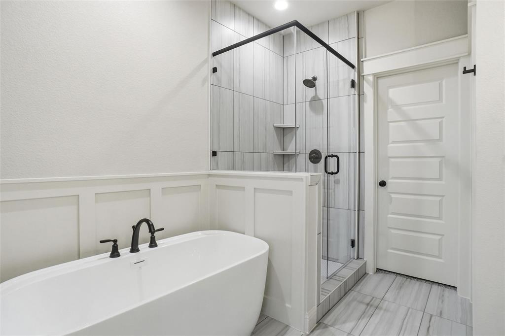201 Legacy Boulevard Weatherford, TX 76085 - Photo 13 of 25 a bathroom with a sink a toilet and shower