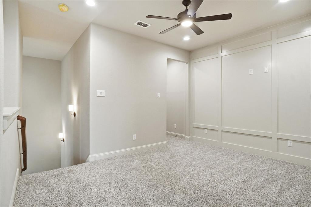 201 Legacy Boulevard Weatherford, TX 76085 - Photo 18 of 25 a view of an empty room and chandelier fan