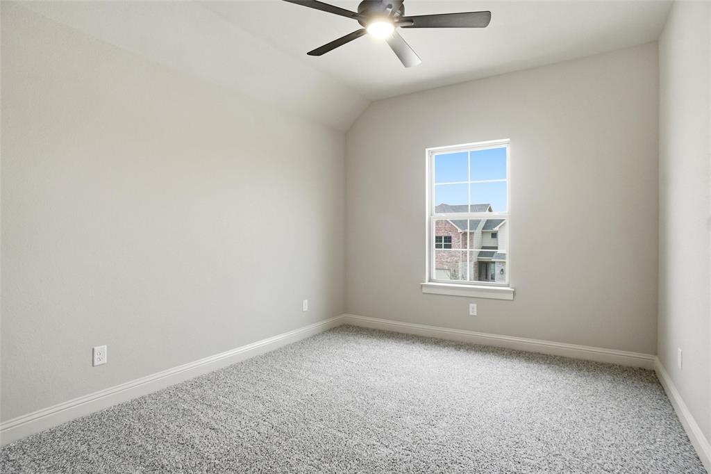 201 Legacy Boulevard Weatherford, TX 76085 - Photo 21 of 25 an empty room with a ceiling fan and window