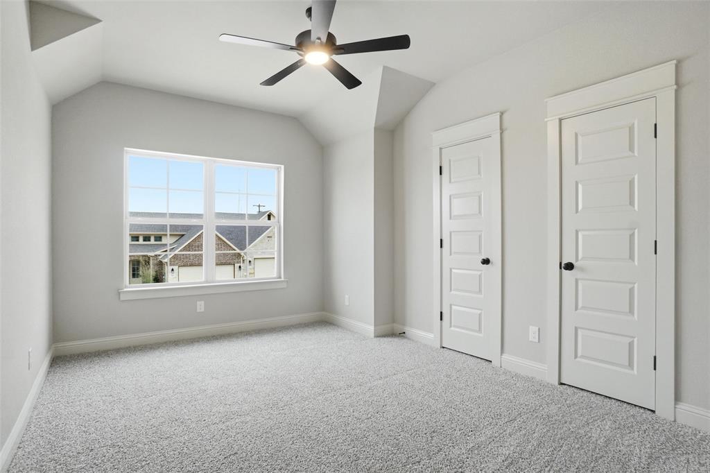 201 Legacy Boulevard Weatherford, TX 76085 - Photo 22 of 25 an empty room with windows and fan