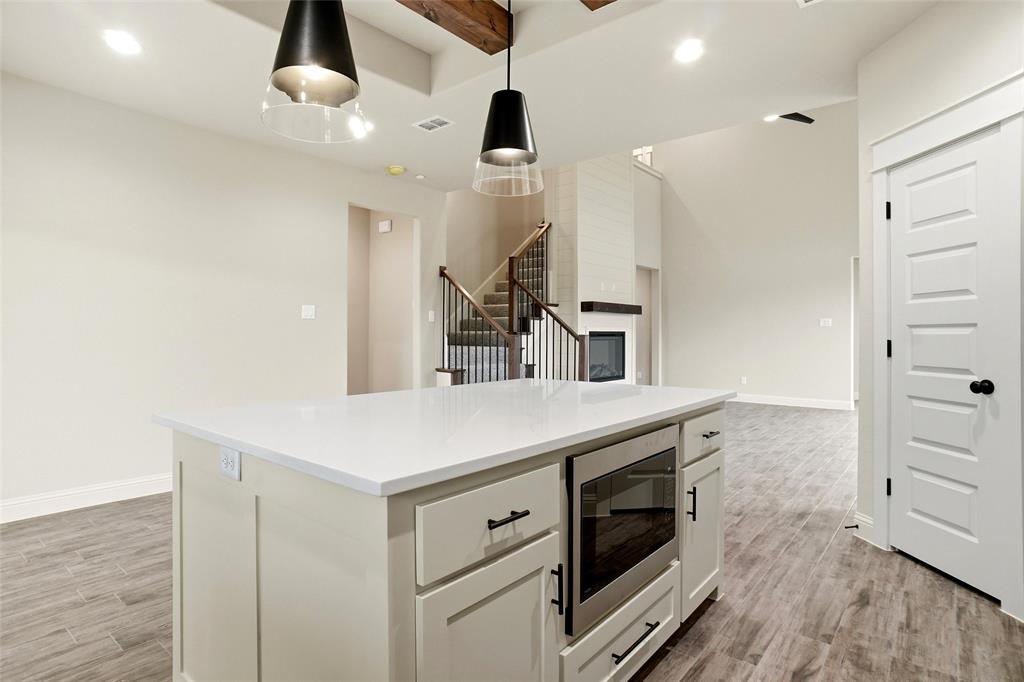 201 Legacy Boulevard Weatherford, TX 76085 - Photo 9 of 25 a kitchen with a sink and a stove top oven