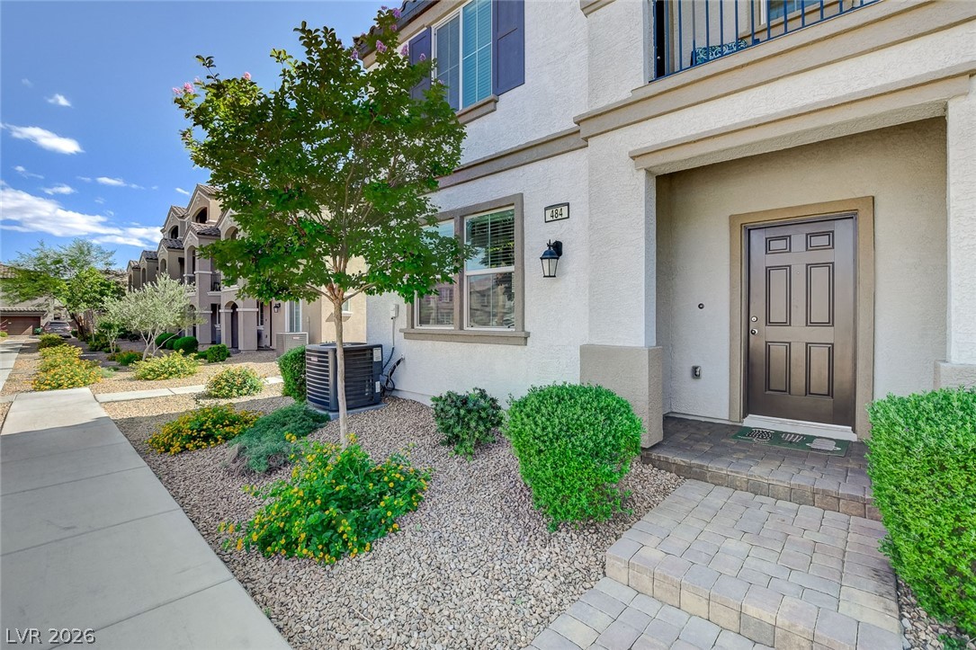 484 Filaree Place Henderson, NV 89015 - Photo 5 of 71 This charming residence features a well-maintained exterior with attractive landscaping and a welcoming entrance.