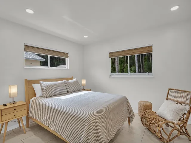 a bedroom with a bed and a couch