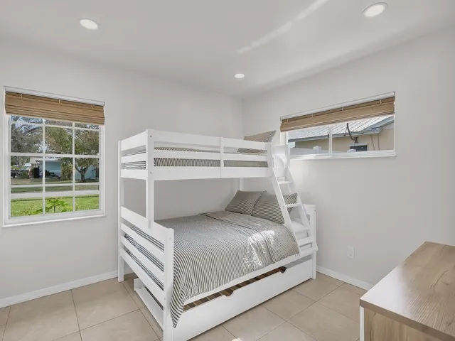 a room with a bed and a window