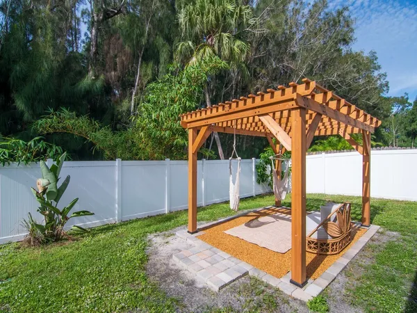 a view of a backyard with a patio