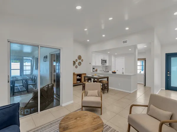 a living room with furniture and a table