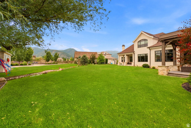 71 Farm Road Midway, UT 84049 - Photo 79 of 92 Expansive green lawn bordering a stucco and stone exterior