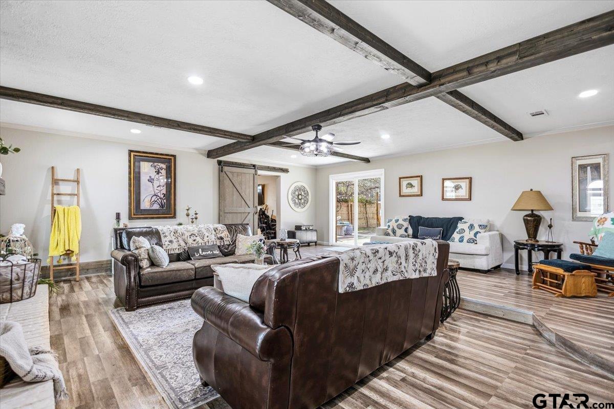 18919 State Highway 64 Canton, TX 75103 - Photo 9 of 42 a living room with furniture hard wood floor and a ceiling fan