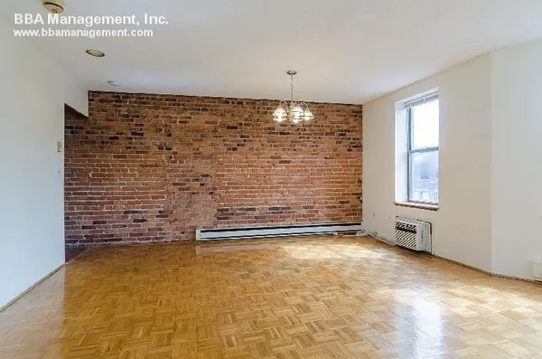 a living room with furniture and a dining table