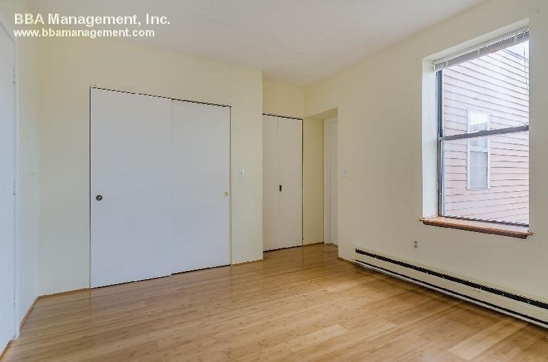 4 Cypress Road, Unit 406 Boston, MA 02135 - Photo 21 of 31 a view of an empty room with a window