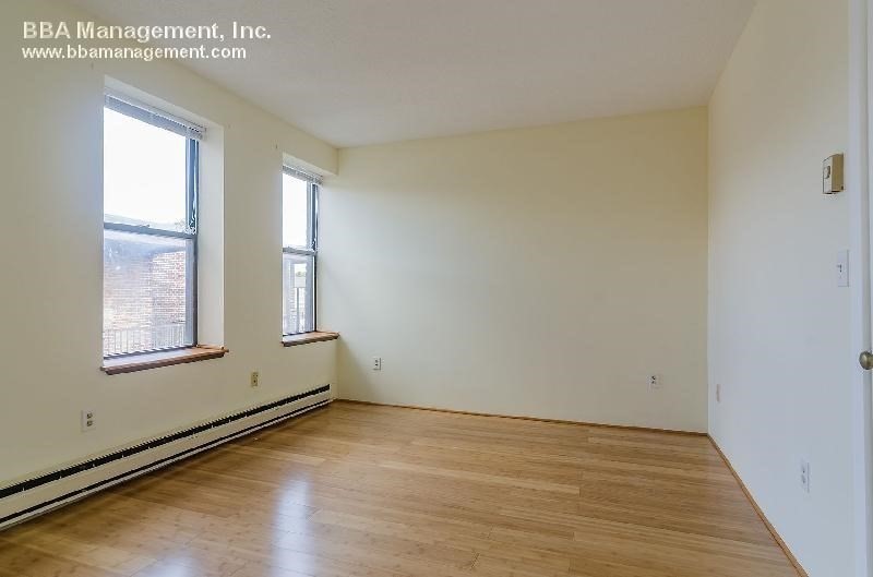 4 Cypress Road, Unit 406 Boston, MA 02135 - Photo 23 of 31 an empty room with windows