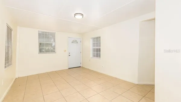 a view of a chandelier fan and entryway