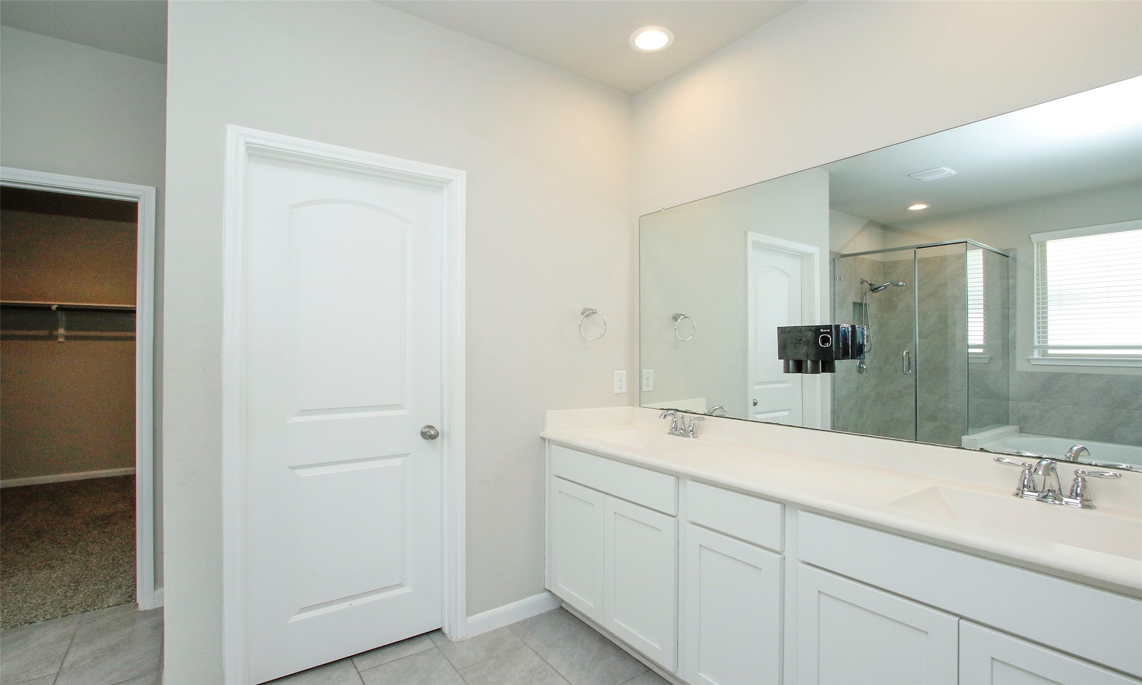 14120 Sand Ridge Court Conroe, TX 77384 - Photo 22 of 43 a spacious bathroom with a double vanity sink mirror and