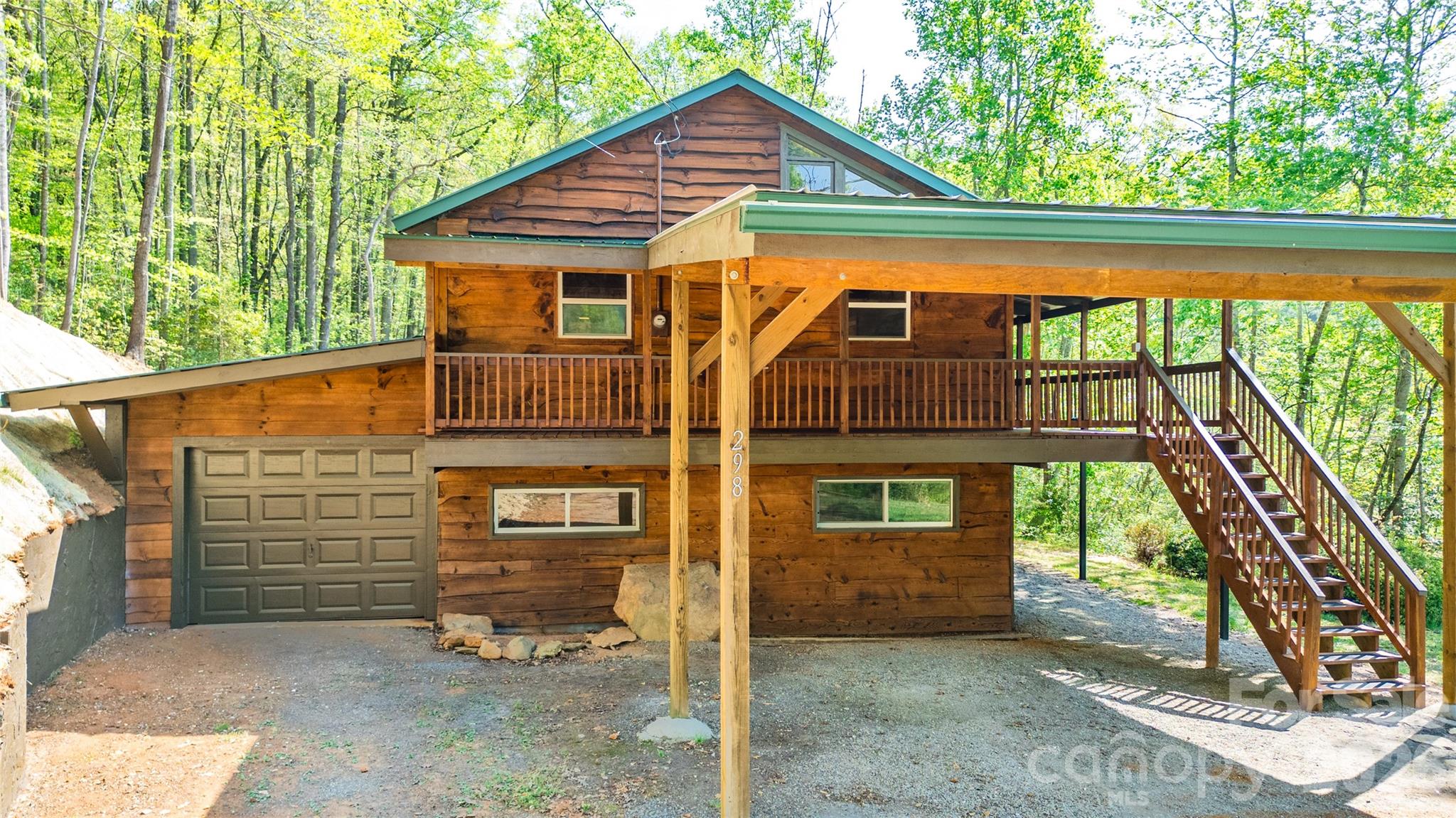 298 Timbuktu Road Sylva, NC 28779 - Photo 3 of 24 a view of a house with a yard