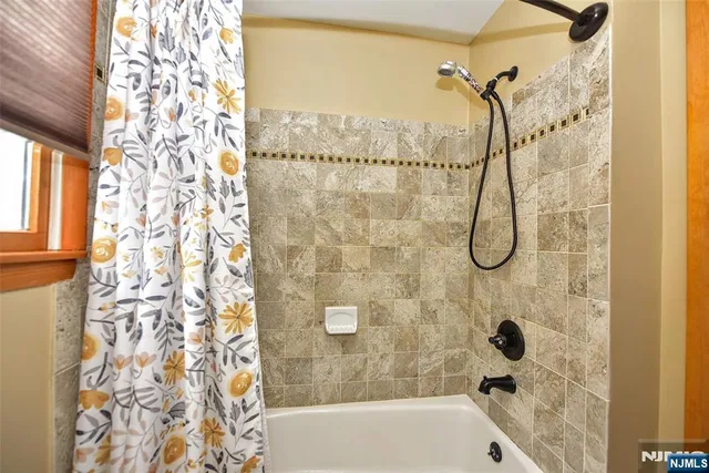 a bathroom with a shower curtain