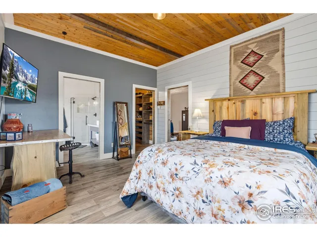 a bedroom with furniture and a bed