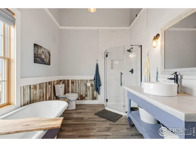 a bedroom with a bed and a table in it