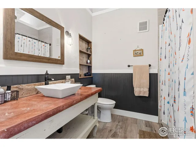 a bedroom with a bed and a cabinets