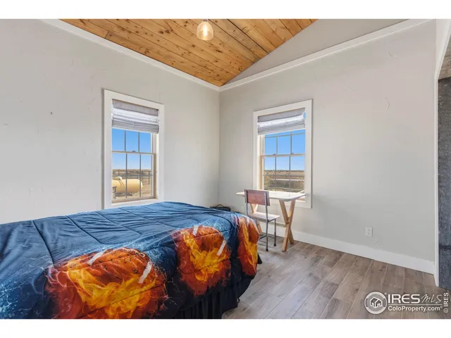 a view of a bedroom with washer and dryer