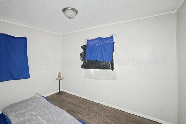 a room with a door and a wooden floor