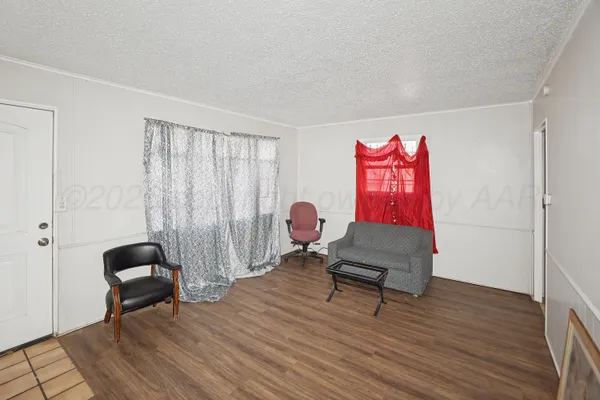 a living room with furniture and a chair
