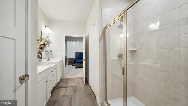 a bathroom with a bathtub and a shower