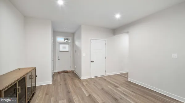 a view of livingroom with hardwood floor and hallway