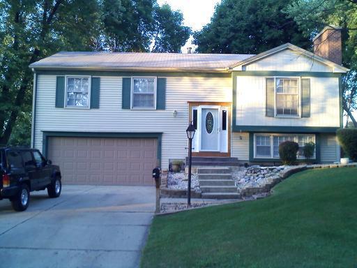 28 Fernwood Road Montgomery, IL 60538 - Photo 1 of 5 a front view of a house with a garden