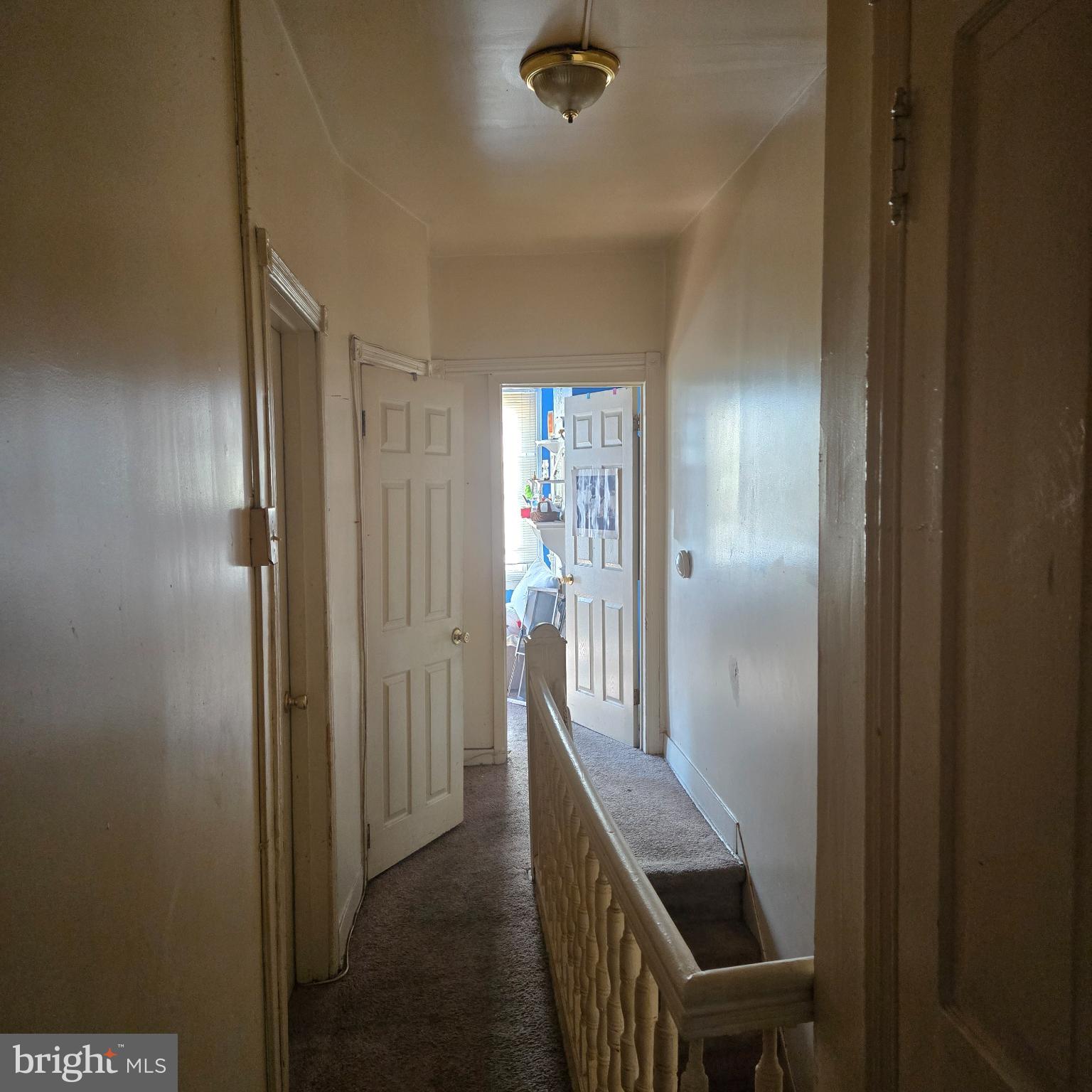 3338 West Sergeant Street Philadelphia, PA 19132 - Photo 11 of 17 Inviting hallway with charming vintage doors.