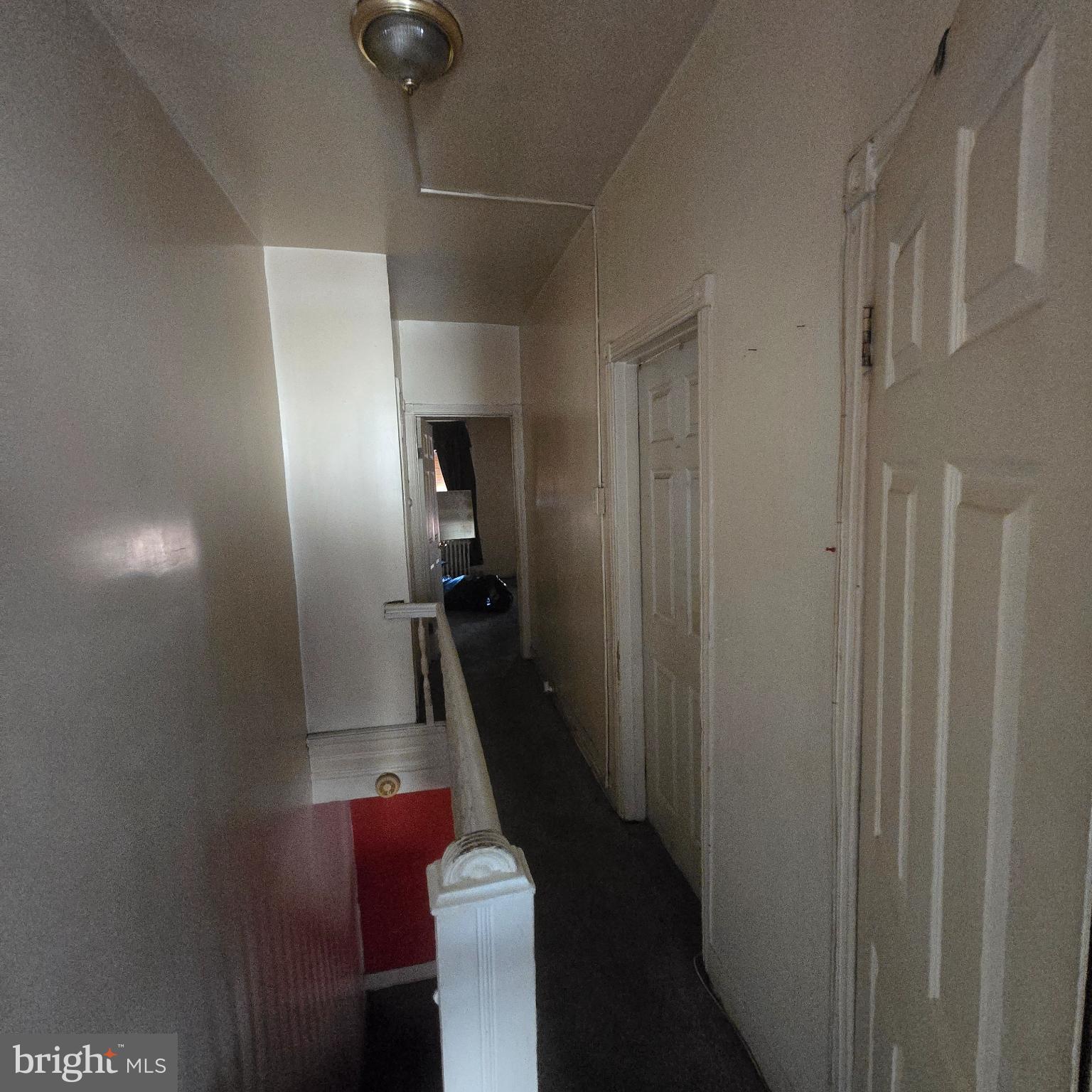 3338 West Sergeant Street Philadelphia, PA 19132 - Photo 14 of 17 Bright and inviting hallway with classic charm.