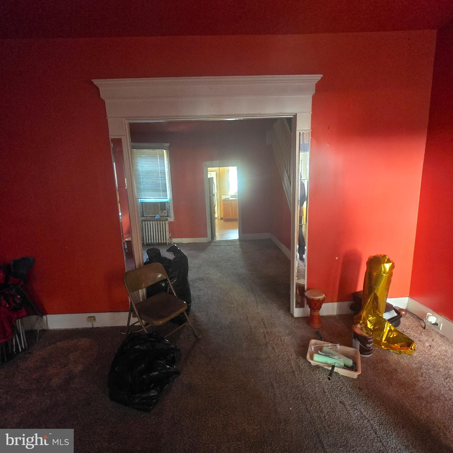 3338 West Sergeant Street Philadelphia, PA 19132 - Photo 2 of 17 Vibrant red walls invite creativity indoors.