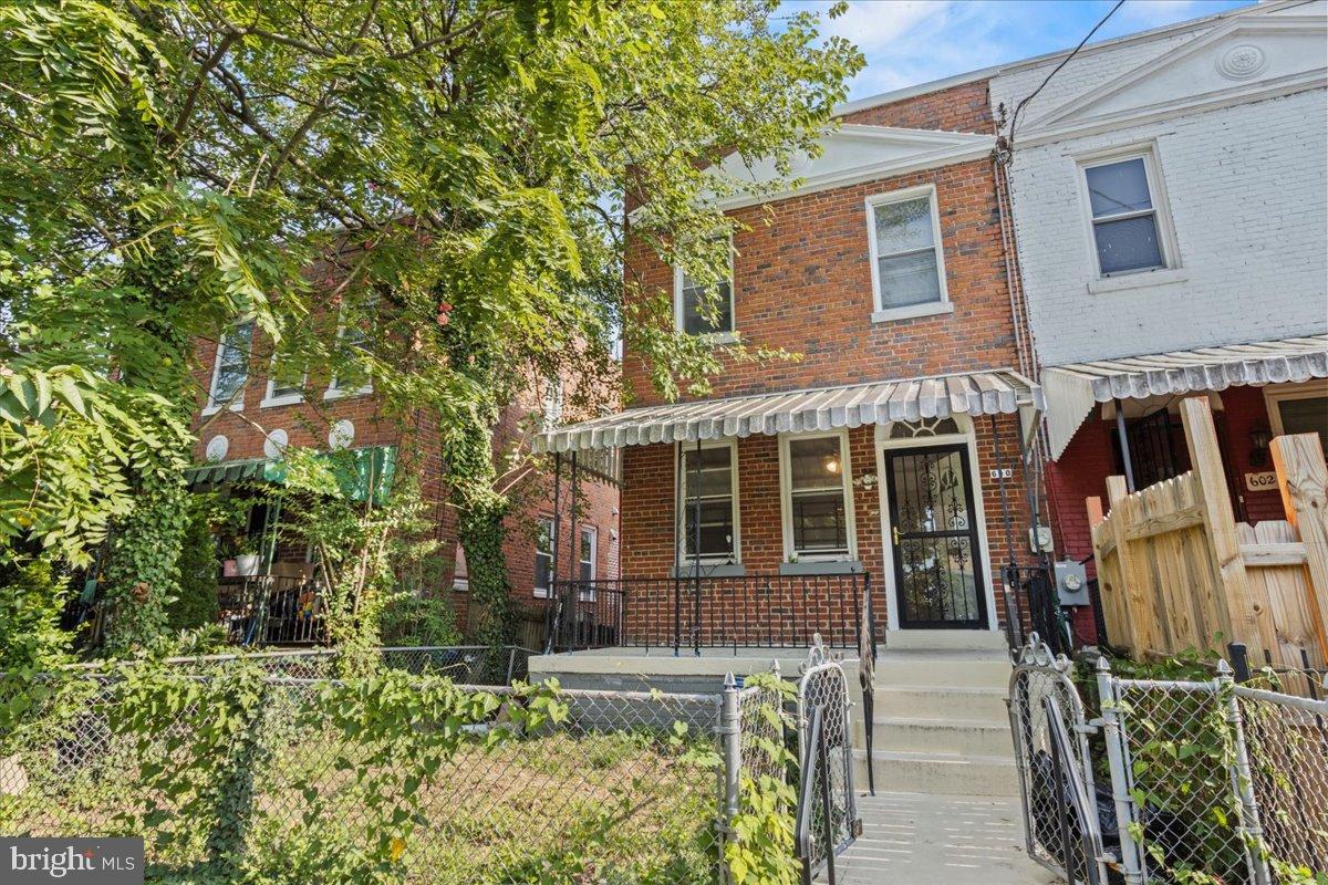 600 Tuckerman Street Northwest Washington, DC 20011 - Photo 1 of 24 front view of a house with a yard