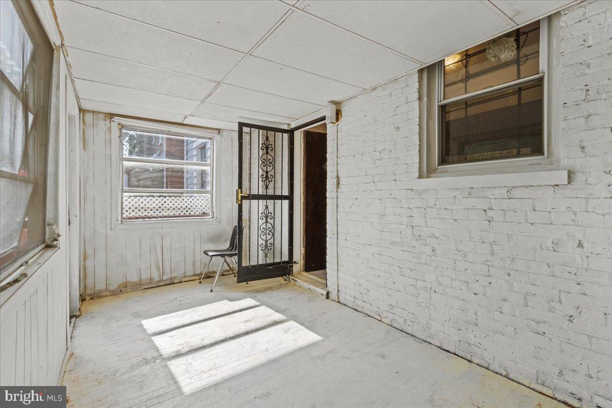 600 Tuckerman Street Northwest Washington, DC 20011 - Photo 11 of 24 a bathroom with a sink a mirror and a shower