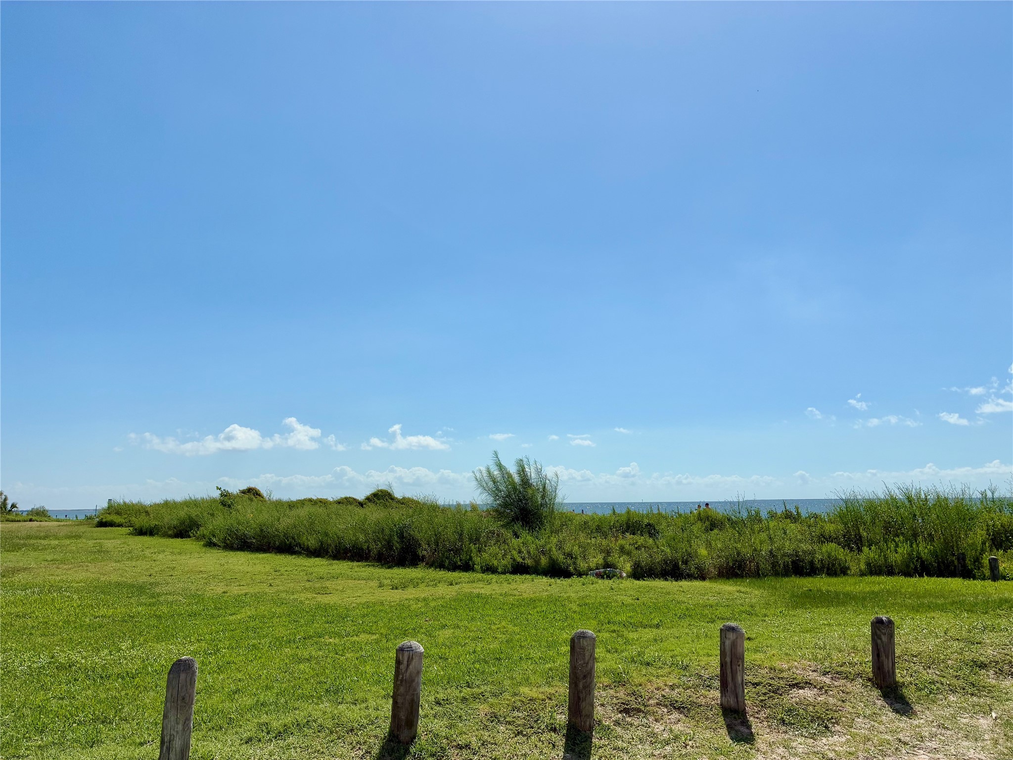 4727 Bland Street Pasadena, TX 77586 - Photo 15 of 17 a view of a lake with a yard