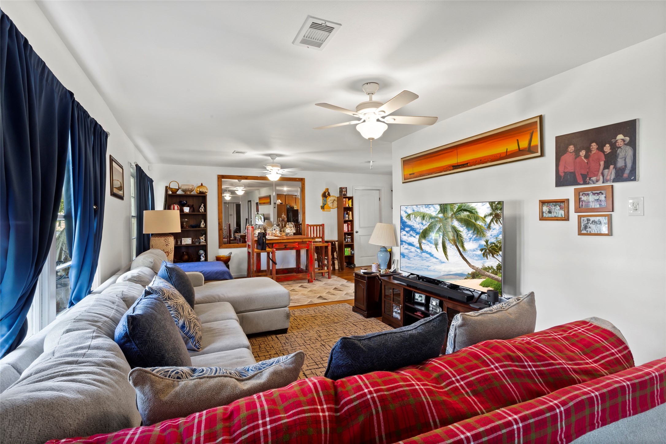 4727 Bland Street Pasadena, TX 77586 - Photo 4 of 17 a living room with furniture ceiling fan and a window