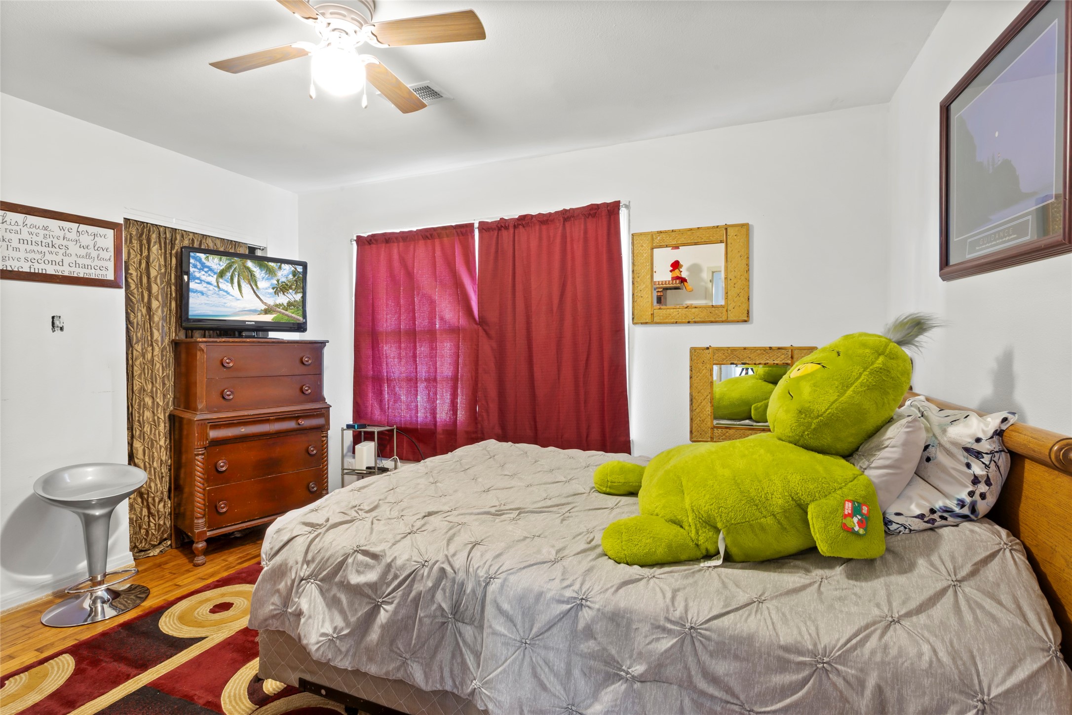 4727 Bland Street Pasadena, TX 77586 - Photo 8 of 17 a bedroom with a bed and furniture