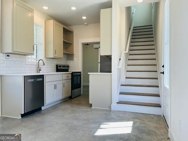 a view of a kitchen with a sink