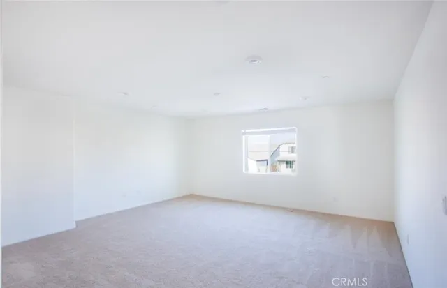 a view of a kitchen with white cabinets