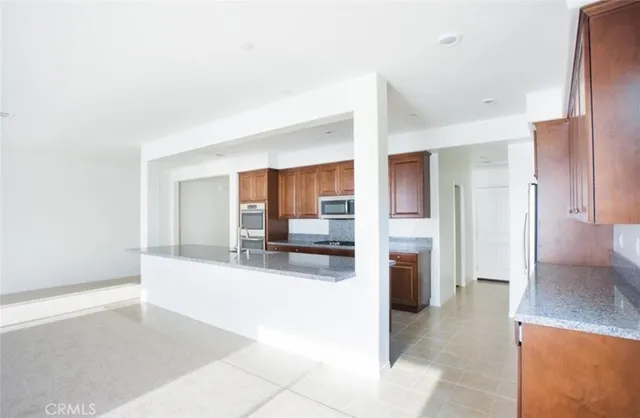 a large en suite bathroom with a tub and a sink