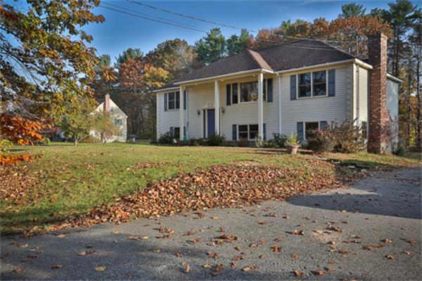 161 Timber Swamp Road Hampton, NH 03842 - Photo 1 of 16 a front view of a house with a yard