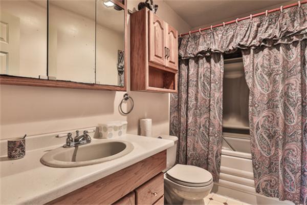 161 Timber Swamp Road Hampton, NH 03842 - Photo 11 of 16 a bathroom with a sink a toilet and a mirror