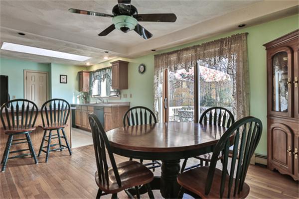 161 Timber Swamp Road Hampton, NH 03842 - Photo 12 of 16 a view of a a dining room with furniture window and wooden floor