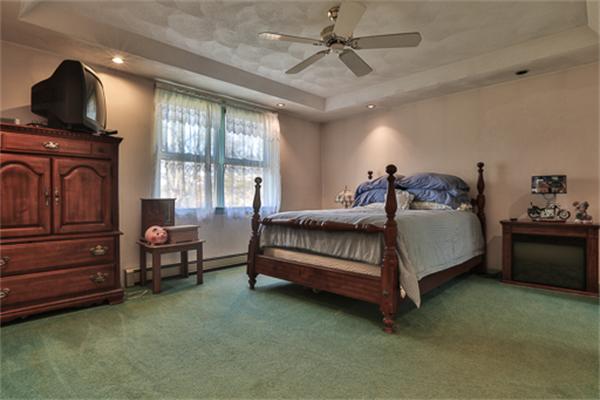 161 Timber Swamp Road Hampton, NH 03842 - Photo 14 of 16 a spacious bedroom with a bed and a window
