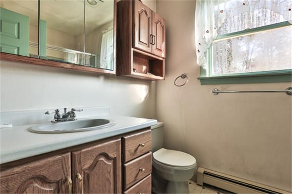 161 Timber Swamp Road Hampton, NH 03842 - Photo 15 of 16 a bathroom with a sink and a toilet
