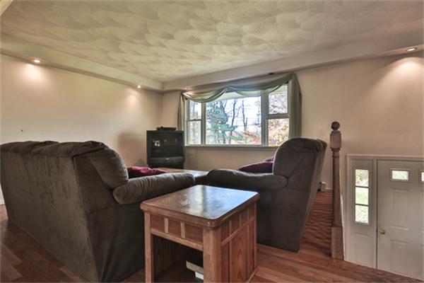161 Timber Swamp Road Hampton, NH 03842 - Photo 5 of 16 a living room with furniture a window and wooden floor