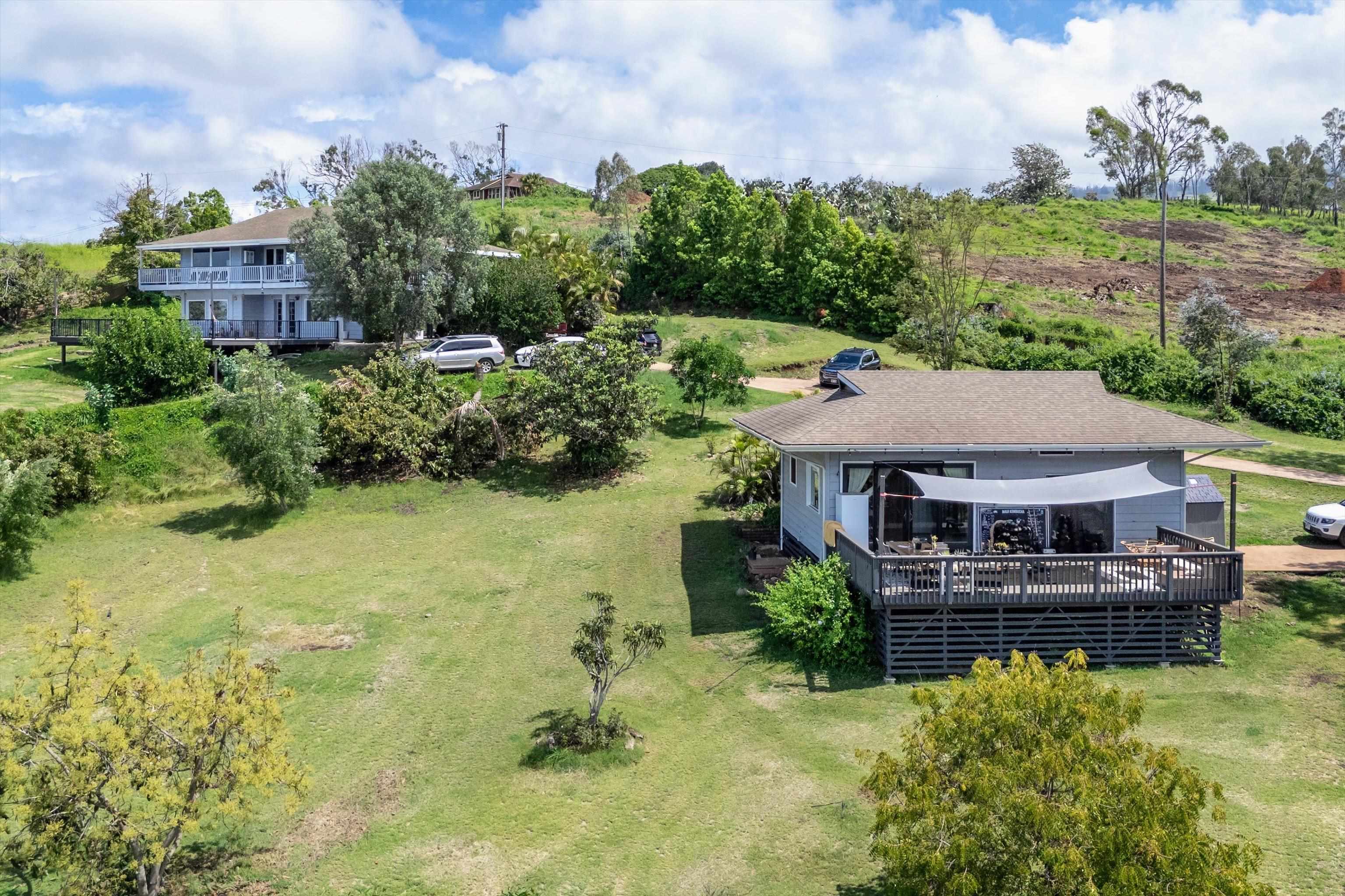 216 Keoni Place Kula, HI 96790 - Photo 20 of 29 an aerial view of a house with swimming pool a yard and a fountain