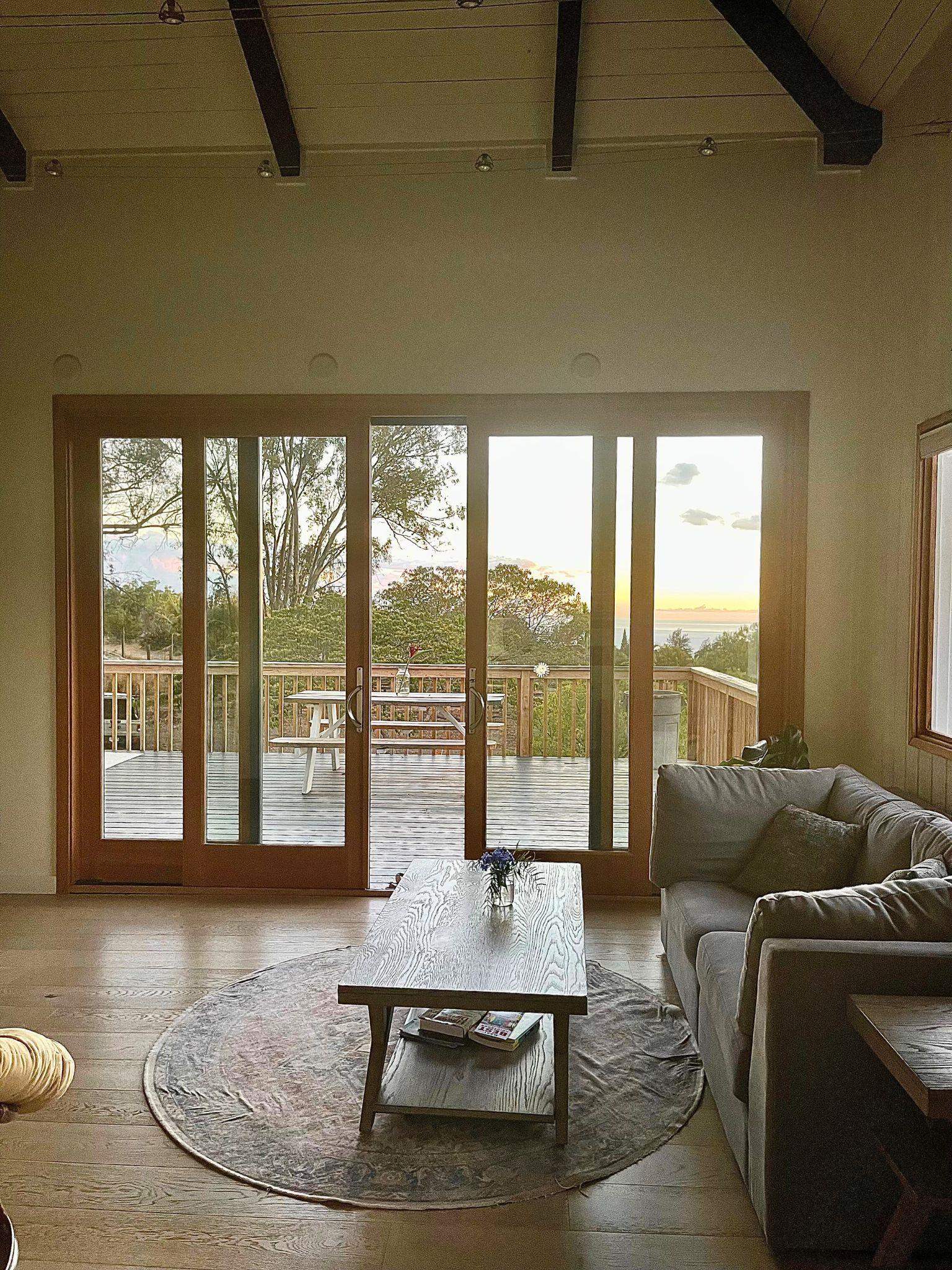 216 Keoni Place Kula, HI 96790 - Photo 22 of 29 a living room with furniture and floor to ceiling windows