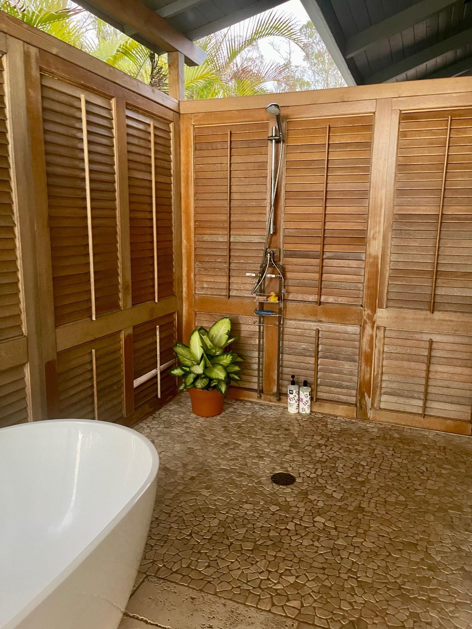 216 Keoni Place Kula, HI 96790 - Photo 27 of 29 a view of a bathroom with a tub and door